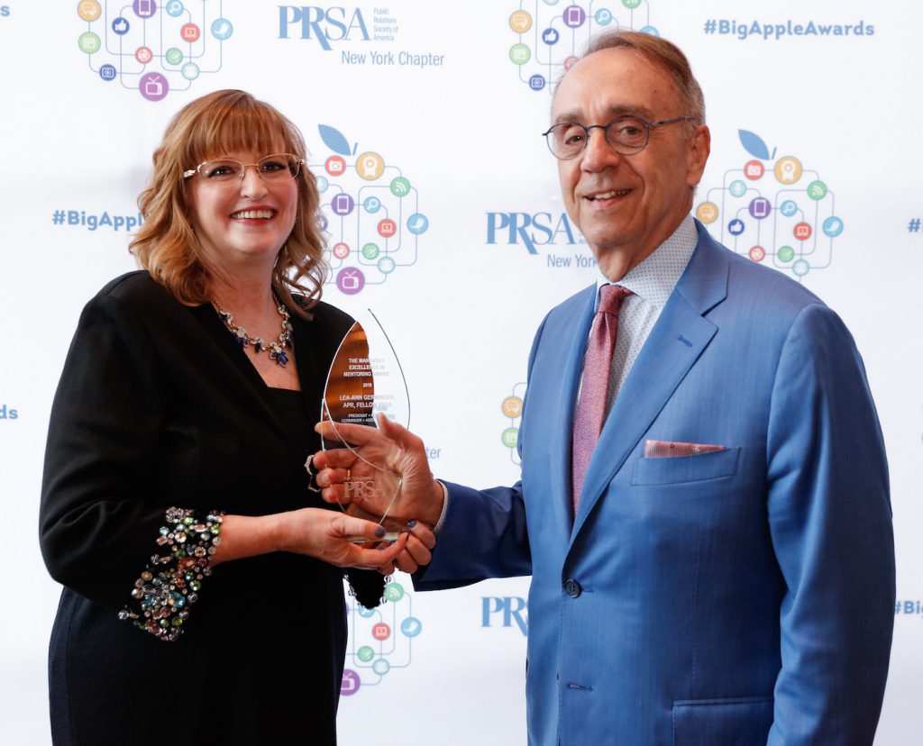 Lea-Ann Germinder, APR Fellow PRSA receiving the Makovsky Excellence in Mentoring Award from Ken Makovsky at the Big Apple Awards. 